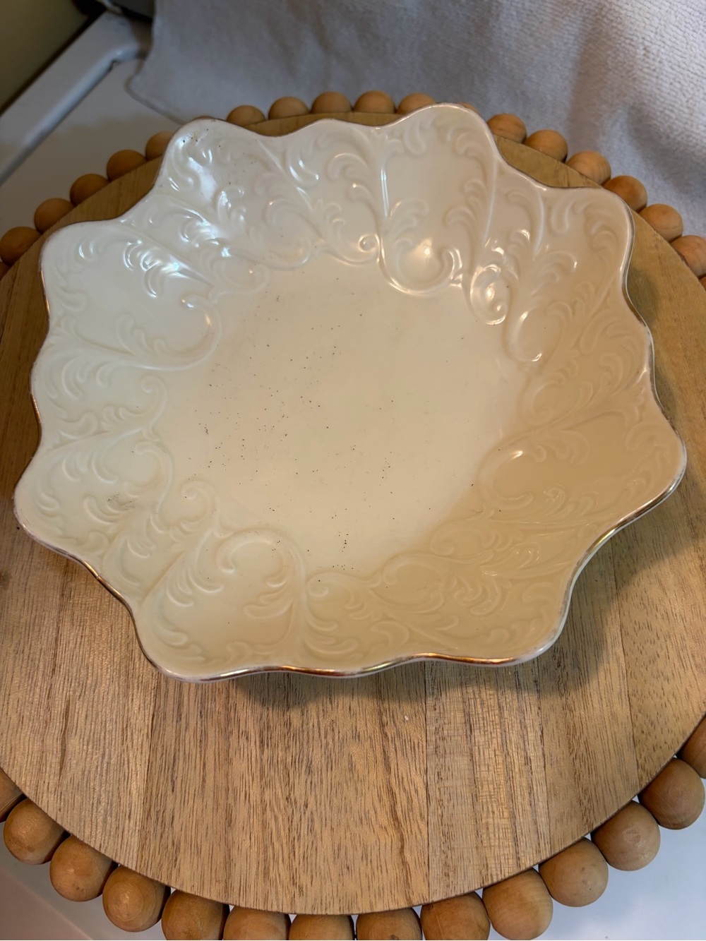 Cream Scalloped Ceramic Serving Bowl with Embossed Scrolls